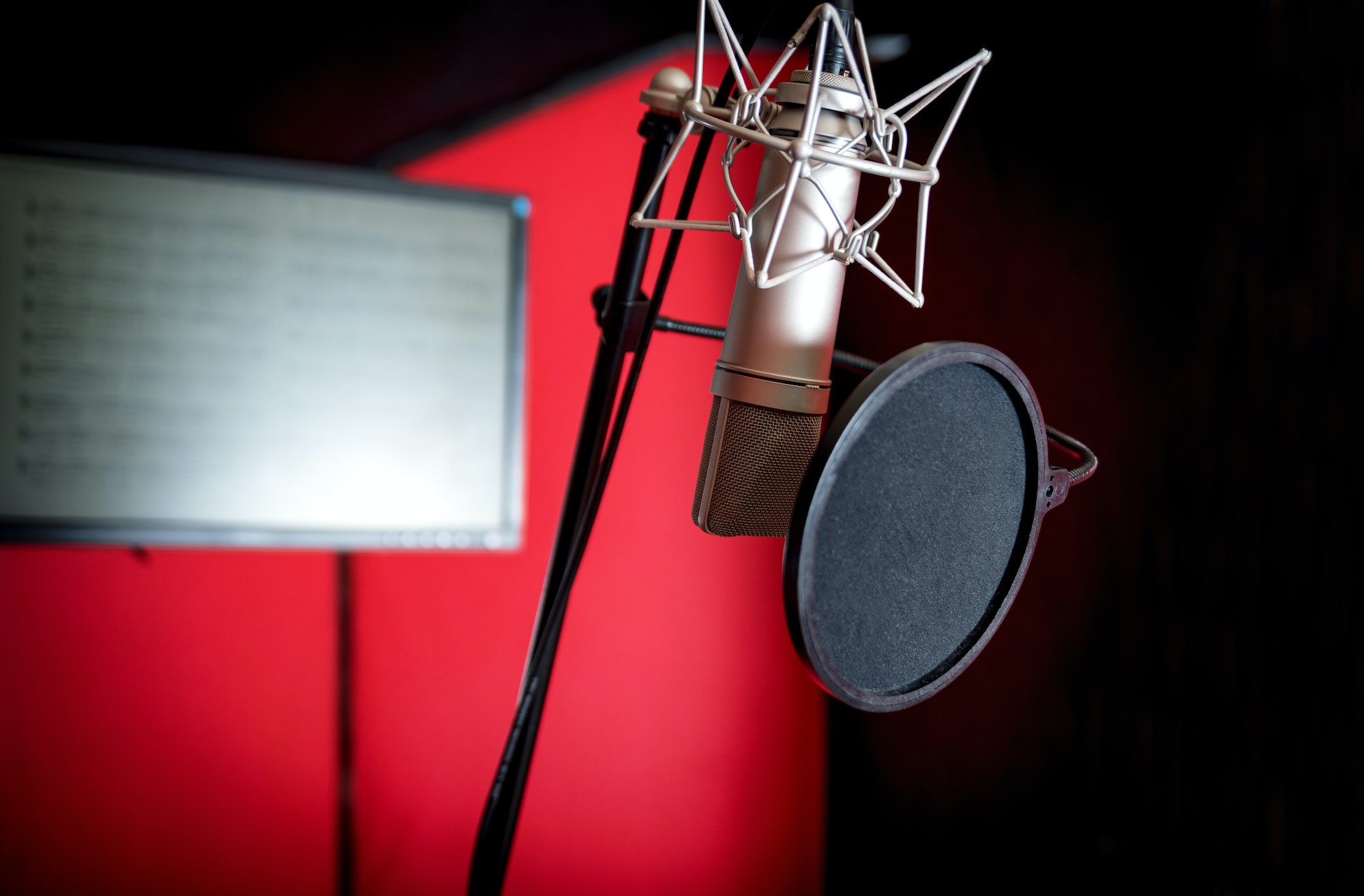 Professional microphone recording voice in music studio